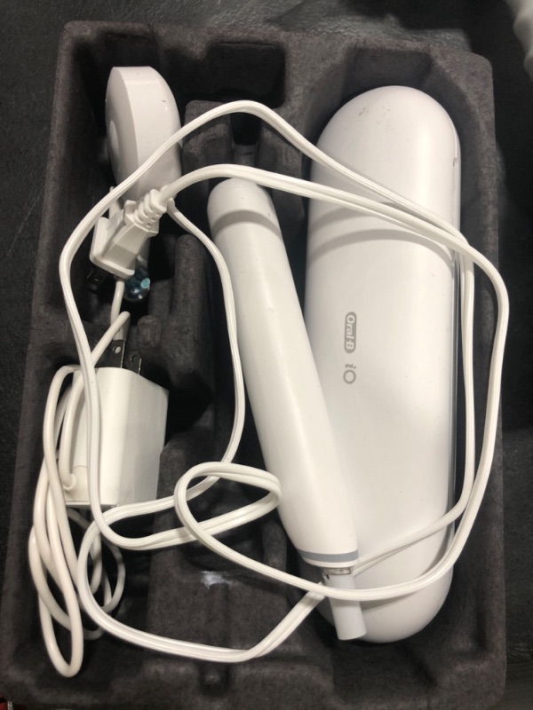 Photo 1 of Oral-B iO Deep Clean + Protect Rechargeable Electric Toothbrush, White with a iO Series 7 Toothbrush, 2 Replacement Brush Heads, and a Charging Travel Case