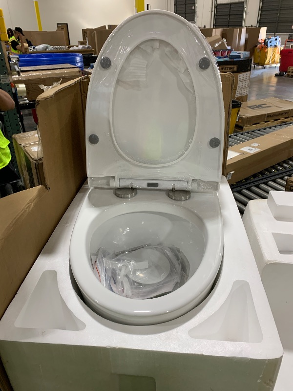 Photo 1 of SYMMETRY One-Piece Elongated Toilet, 1.28 GPF Single-Flush