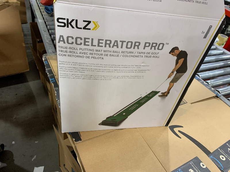 Photo 1 of SKLZ ACCELERATOR PRO - Indoor Golf Putting Mat with Auto-Ball Return & Behind-the-Hole Ball Collector - Putter Alignment Guides at 3, 5 & 7 Feet - Rubber-Backed Mat Provides Multi-Surface Stability
