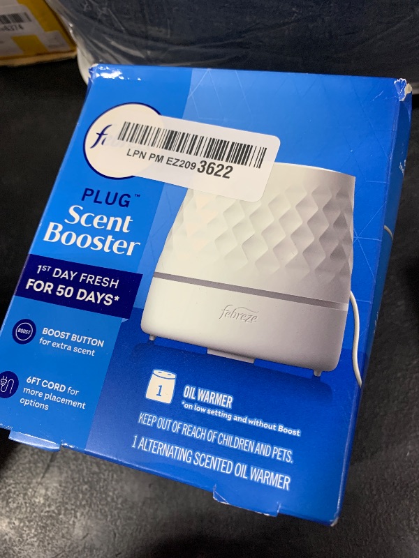 Photo 1 of Febreze Plug Scent Booster Continuous Scent Device Oil Diffuser, Compatible with Febreze Air Freshener Plug in Refills