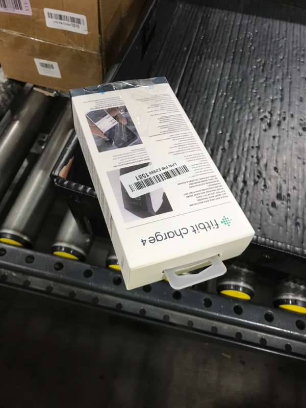 Photo 1 of Fitbit Charge 4 Black Advanced Fitness Tracker
