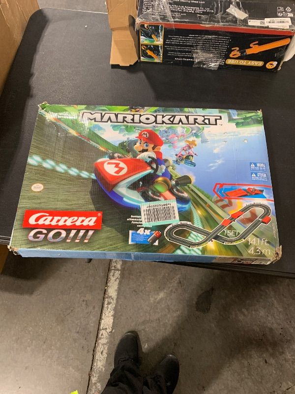 Photo 1 of ITEM IS MISSING PARTS, UNSURE WHAT PARTS ARE MISSING ---------------------------------------Carrera GO!!! 63503 Official Licensed Mario Kart Battery Operated 1:43 Scale Slot Car Racing Toy Track Set with Jump Ramp Featuring Mario and Luigi for Kids Ages 5