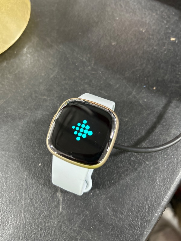 Photo 1 of Fitbit Sense 2 Advanced Health and Fitness Smartwatch with Tools to Manage Stress and Sleep, ECG App, SpO2, 24/7 Heart Rate and GPS, Blue Mist/Pale Gold, One Size (S & L Bands Included)