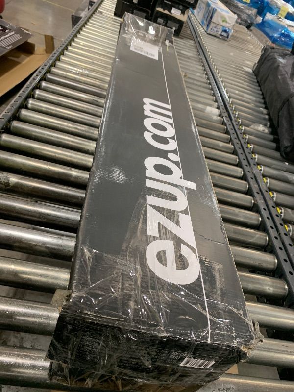 Photo 1 of E-Z UP Regency 10' x 10' Straight Leg Canopy with Side Wall and 4 Weight Bags
