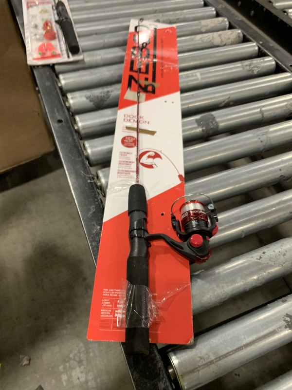 Photo 1 of Zebco Dock Demon Spinning Reel and Fishing Rod Combo, 30-inch 1-Piece Fiberglass Fishing Pole, EVA Rod Handle, Size 10 Reel, Powertrain Drag, Pre-Spooled with 6-Pound Zebco Line, Red