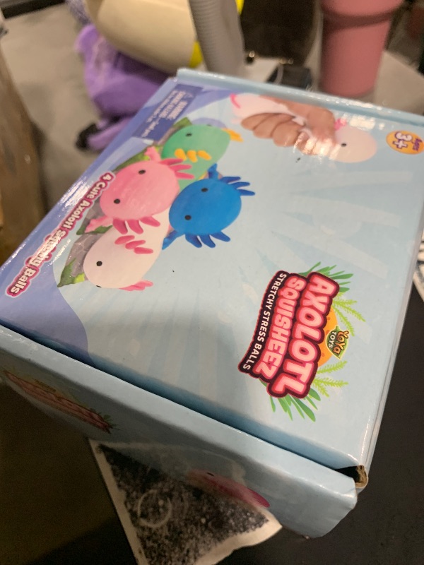 Photo 1 of YoYa Toys Squisheez Axolotl 4Pack - Mini Squishy Animal Toys for Stress Relief - Fun and Cute Toys for Kids and Adults - Kawaii Squishies in Pink, White, Green, and Blue