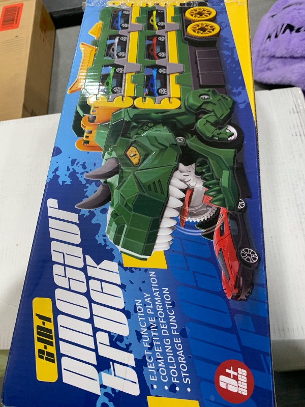 Photo 1 of Dinosaur Race Track Toys for Kids 3-12, Transport Truck Toy with 12 Race Cars, Transforming Dino Truck Set with 61.8 inch Dual-Way Foldable Tracks, Toddler Gift Toys for Boys & Girls
