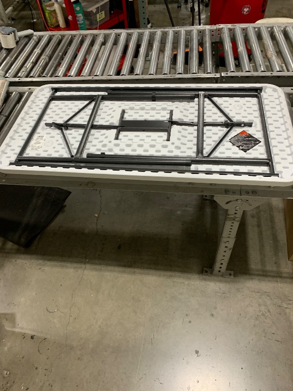 Photo 1 of White Folding Table 
