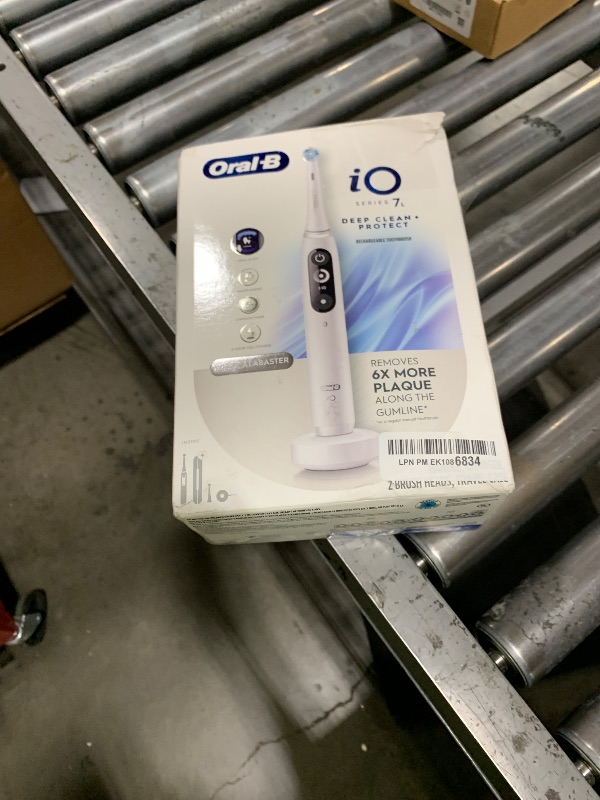 Photo 1 of Oral-B iO Deep Clean + Protect Rechargeable Electric Toothbrush, White with a iO Series 7 Toothbrush, 2 Replacement Brush Heads, and a Charging Travel Case