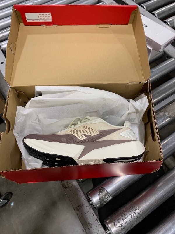 Photo 1 of New Balance Women's FuelCell Rebel V5 Running Shoe, Angora/Earth Shadow/Sea Salt, 11