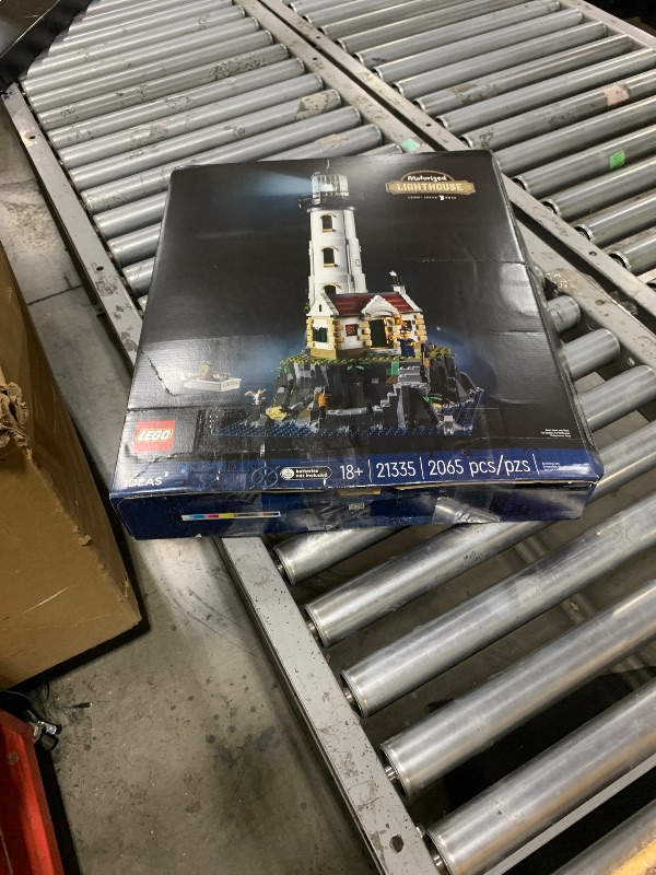 Photo 1 of LEGO Ideas Motorized Lighthouse 21335 Adult Model Building Kit, Complete with Rotating Lights, Quaint Cottage and a Mysterious Cave, Creative Gift Idea