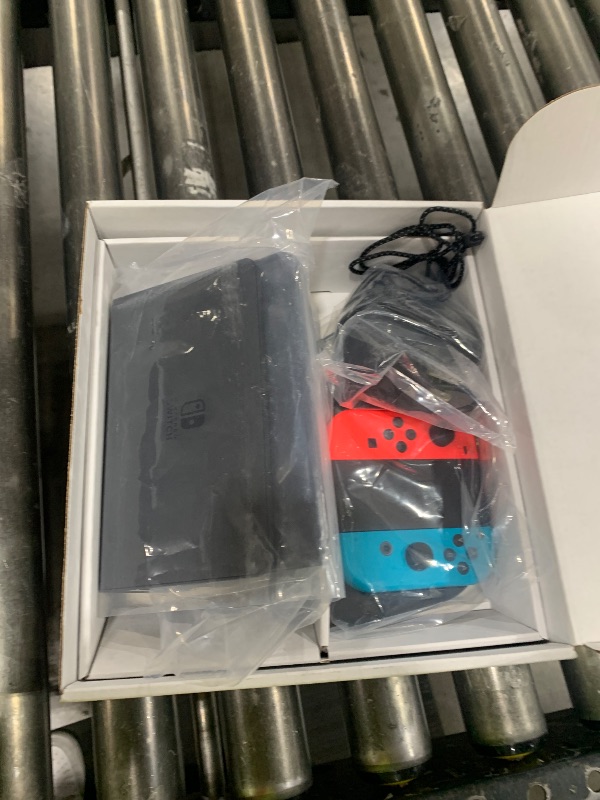 Photo 1 of Nintendo Switch (OLED model) w/Neon Red & Neon Blue Joy-Con (Renewed Premium)