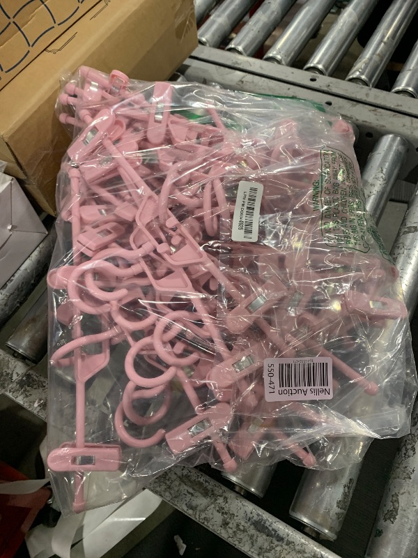 Photo 1 of POZEAN Plastic Hangers - 30 Pack Stackable Skirt Pants Hangers, 360 Rotating Adjustable Clips, Space Saving for Skirts, Shorts (Pink)