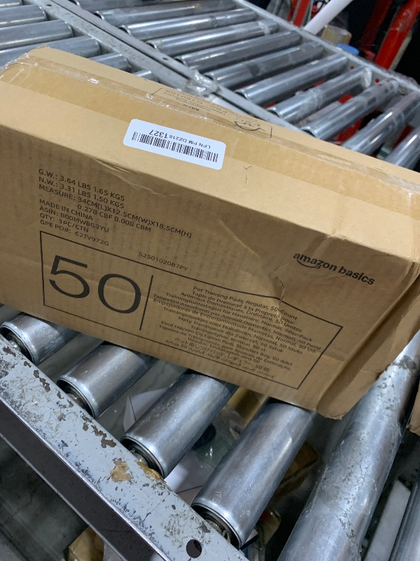 Photo 1 of Amazon Basics Absorbent, Leak-Proof Dog and Puppy Pee Pads with 5-Layer Design and Quick-Dry Surface for Potty Training, Standard Absorbency, Regular Size, 22 x 22 Inch - Pack of 50, Blue & White