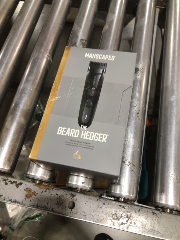 Photo 1 of MANSCAPED® The Beard Hedger® Premium Men's Beard Trimmer, 20 Length Adjustable Blade Wheel, Stainless Steel T-Blade for Precision Facial Hair Trimming, Cordless Waterproof Wet/Dry Clipper