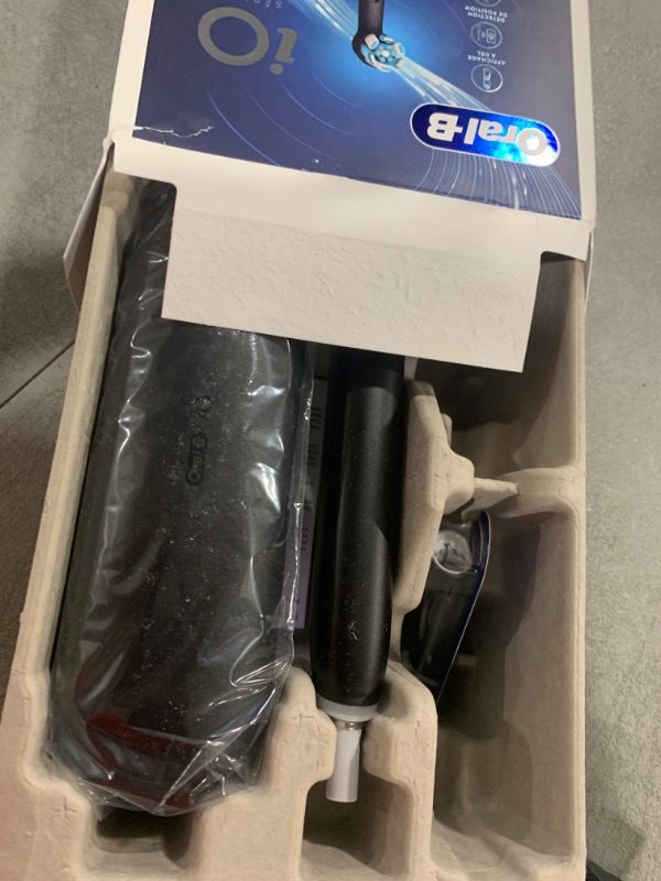 Photo 1 of Oral-B iO Series 5 Rechargeable Electric Toothbrush with Visible Pressure Sensor to Protect Gums, 2 Minute Timer, 5 Cleaning Settings, 1 Replacement Toothbrush Heads, and Travel Case, Black