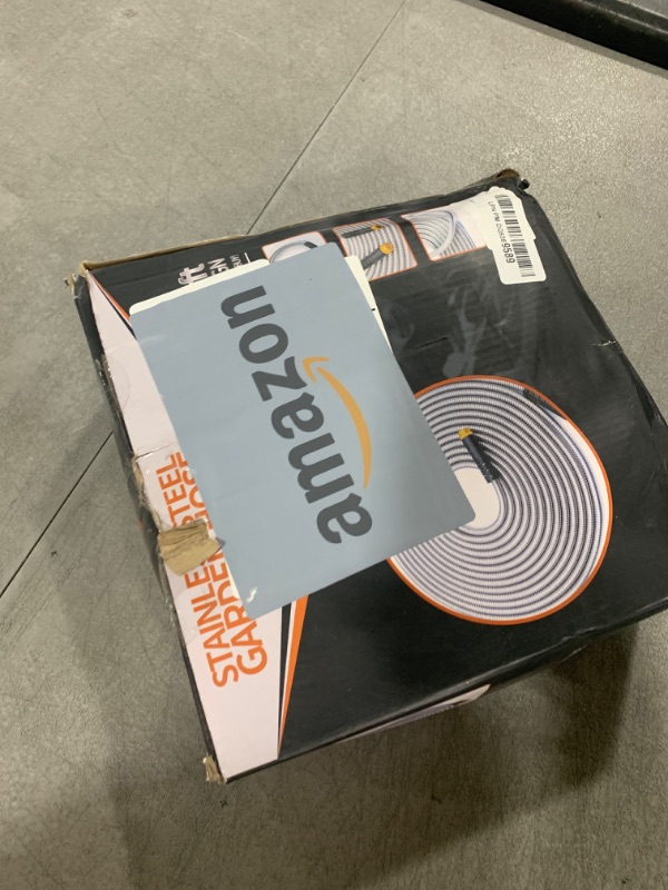Photo 1 of Garden Hose 50 ft, Stainless Steel Water Hose with 10 Function Nozzle Flexible, Heavy Duty, Lightweight, No-Kink, Pet Proof, Puncture Proof Hose Metal for Yard, Outdoor