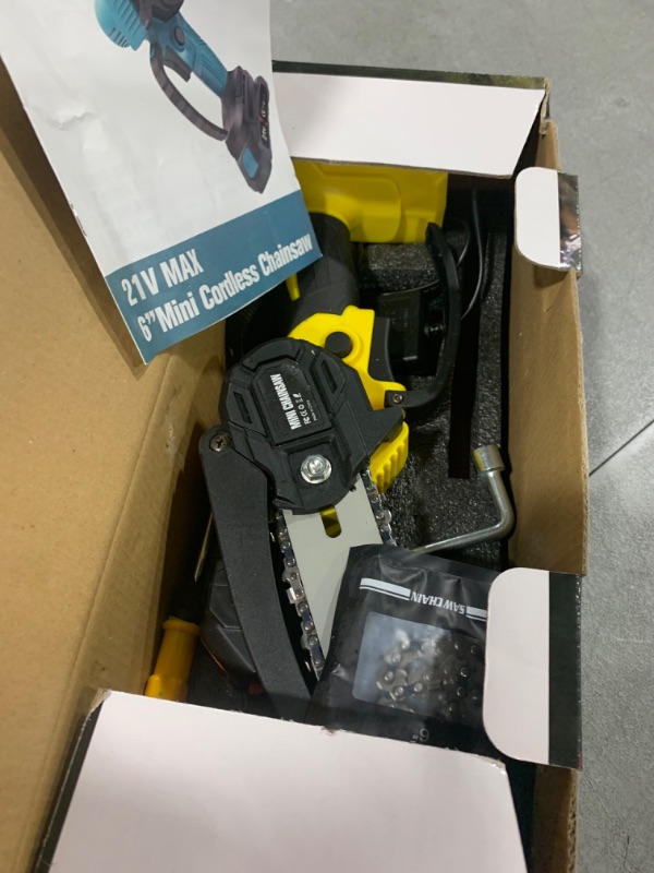 Photo 1 of Mini Chainsaw Cordless 6 Inch, Electric Chain Saw, Portable Handheld Small Chainsaw, Battery Powered Hand Saw With Security Lock for Trees Branches Trimming Wood Cutting (Seniors Friendly)
