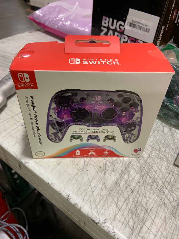 Photo 1 of PDP Gaming Afterglow Wireless Nintendo Switch Pro Controller: Prismatic RGB LED Lighting, Full Motion Control Gamepad, Customizable Paddle Buttons