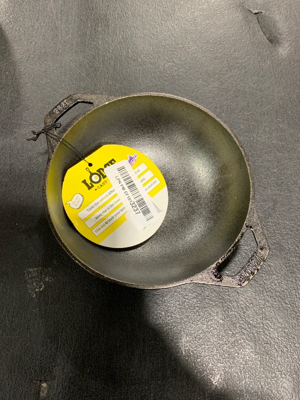 Photo 1 of Lodge Pre-Seasoned Cast Iron Mini WOK - Dual Assist Handle - Use in the Oven, on the Stove, or on the Grill - 6.25 Inch