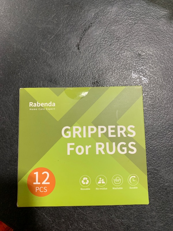 Photo 1 of Rabenda 12 Pcs Rug Tape, Non Slip Rug Pads Grippers for Hardwood Floors and Tiles, Reusable Carpet Tape for Area Rugs, Double-Sided Adhesive Rug Stickers Keep Corners Flat (Black)