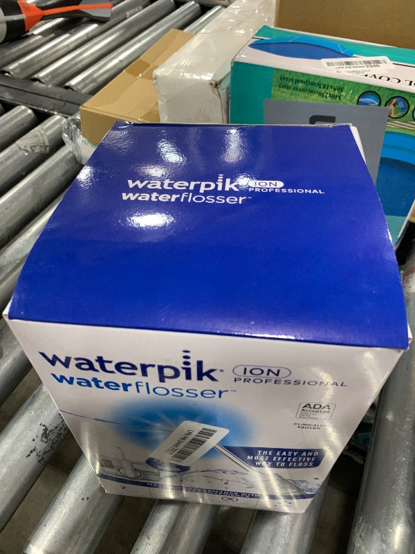 Photo 1 of Waterpik ION Professional Water Flosser, Rechargeable and Portable for Teeth, Gums, Braces, 10 Settings, 7 Flossing Tips For Multiple Users And Needs, ADA Accepted, WF-12 White, Packaging May Vary