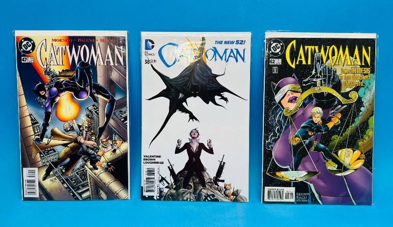Photo 1 of 593090…3 catwoman comics in plastic sleeves 
