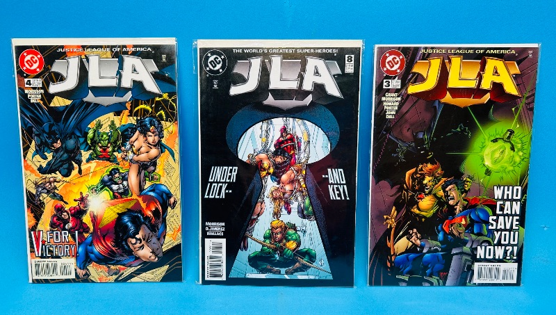 Photo 1 of 593098…3 JLA  comics in plastic sleeves 