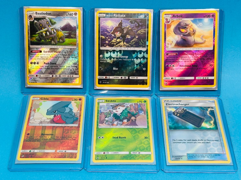 Photo 1 of 593102…6 reverse holo  Pokémon cards in hard plastic sleeves 