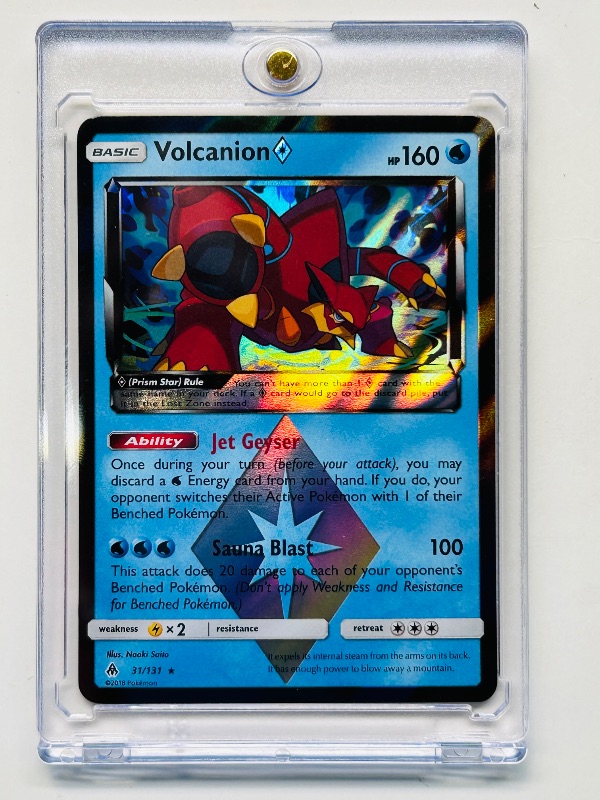 Photo 1 of 593111…Holo Pokémon Volcanion card in hard plastic case