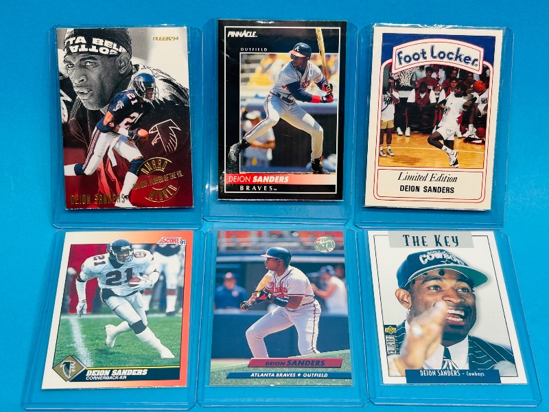 Photo 1 of 593305…Deion Sanders cards in hard plastic sleeves 