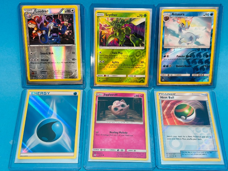 Photo 1 of 593316…6 holo and reverse holo Pokémon cards in hard plastic sleeves 