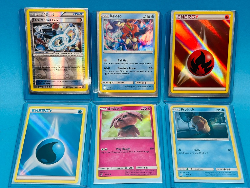 Photo 1 of 593318… 6 holo and reverse holo Pokémon cards in hard plastic sleeves 