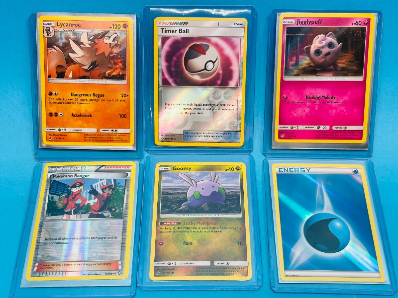 Photo 1 of 593319… 6 holo and reverse holo Pokémon cards in hard plastic sleeves 