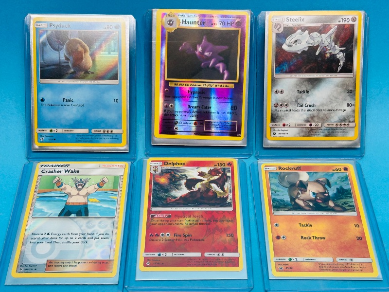 Photo 1 of 593320… 6 holo and reverse holo Pokémon cards in hard plastic sleeves 