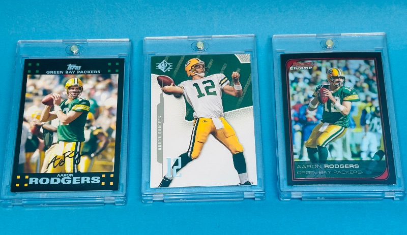 Photo 1 of 593345…3 Aaron Rodgers  cards in hard plastic cases