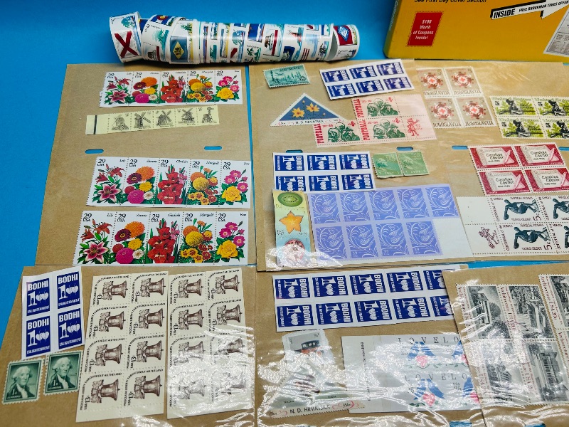 Photo 1 of 593351…stamp collection and books- some used