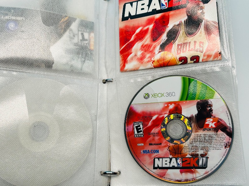 Photo 1 of 593355…10 XBOX and Wii sports game discs in binder-see photos 