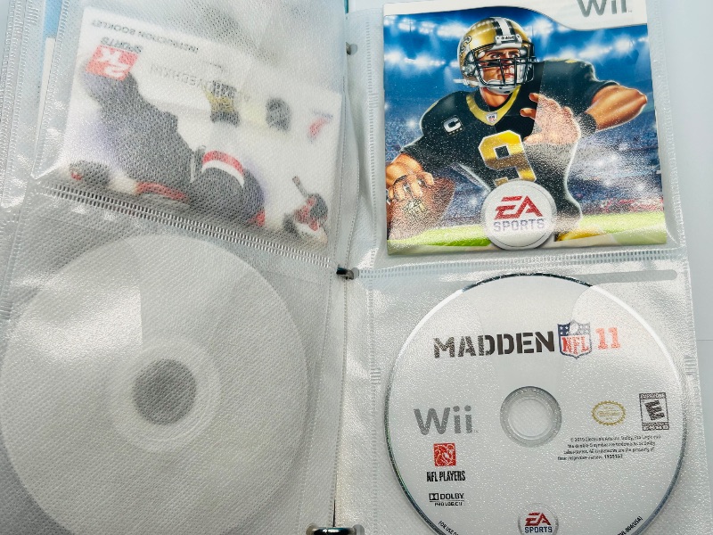 Photo 1 of 593355…10 XBOX and Wii sports game discs in binder-see photos 