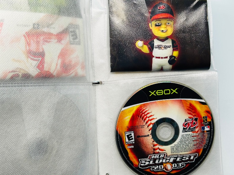 Photo 1 of 593355…10 XBOX and Wii sports game discs in binder-see photos 