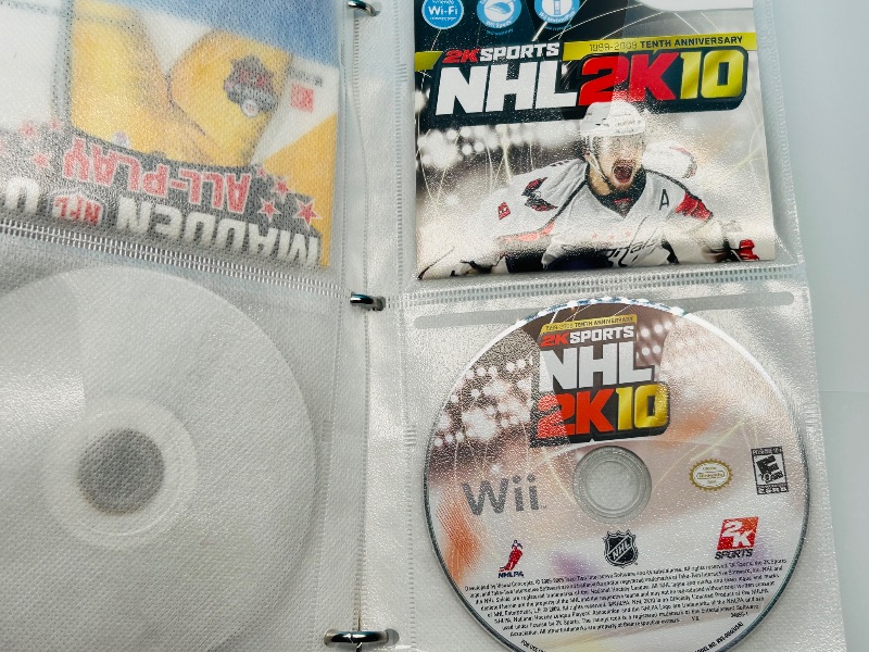 Photo 1 of 593355…10 XBOX and Wii sports game discs in binder-see photos 