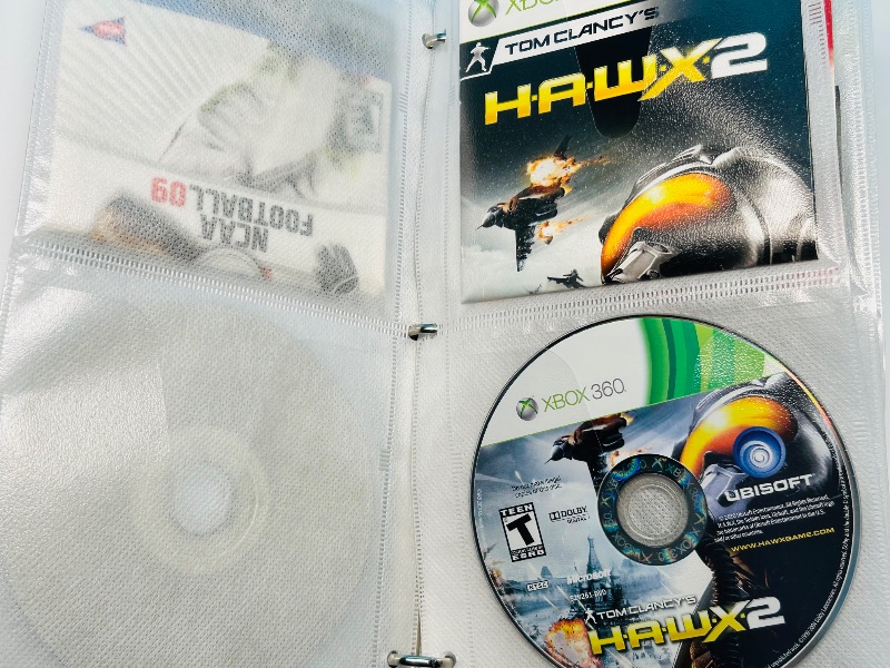Photo 1 of 593355…10 XBOX and Wii sports game discs in binder-see photos 