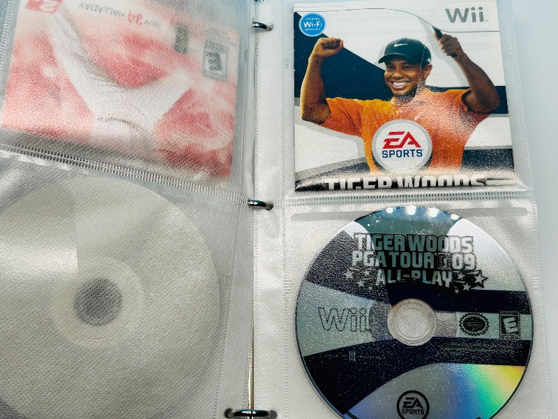 Photo 1 of 593355…10 XBOX and Wii sports game discs in binder-see photos 