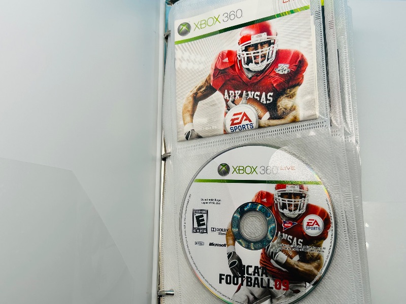 Photo 1 of 593355…10 XBOX and Wii sports game discs in binder-see photos 