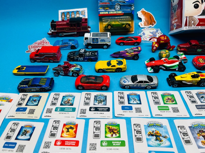 Photo 1 of 593359…die cast cars,  stickers  and toys 