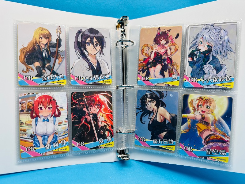 Photo 1 of 593360…final sale no returns/refunds-56 anime cards in binder
