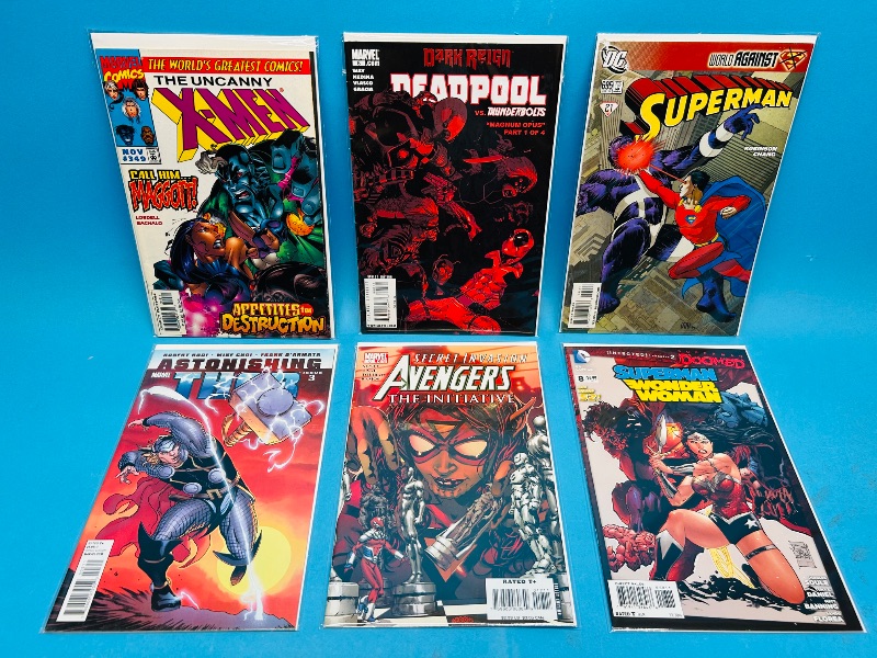 Photo 1 of 593383…6  comics in plastic sleeves 