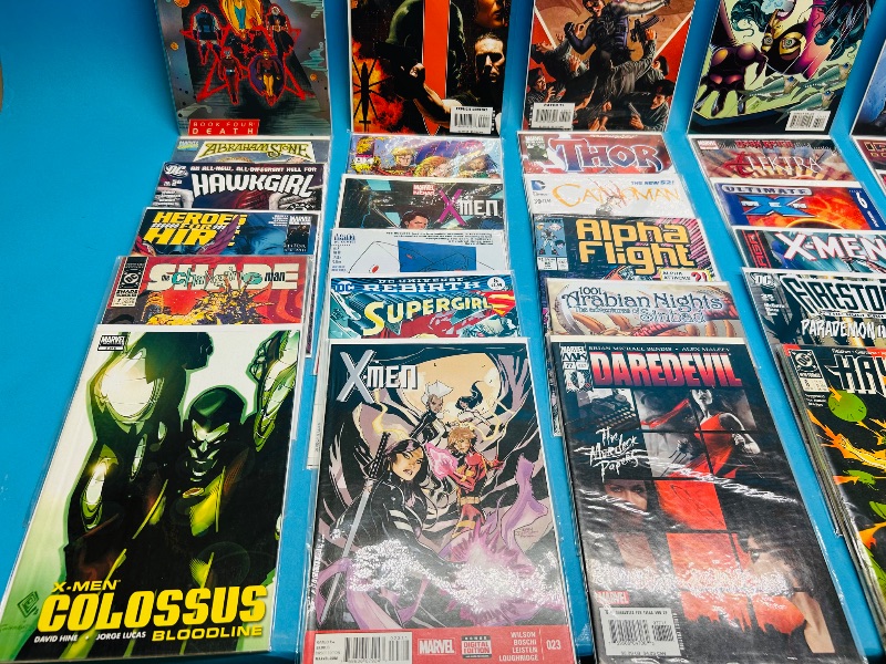 Photo 1 of 593389…final sale no returns/refunds-30 comics in plastic sleeves 