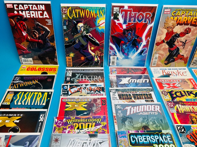 Photo 1 of 593390… final sale no returns/refunds-30 comics in plastic sleeves 