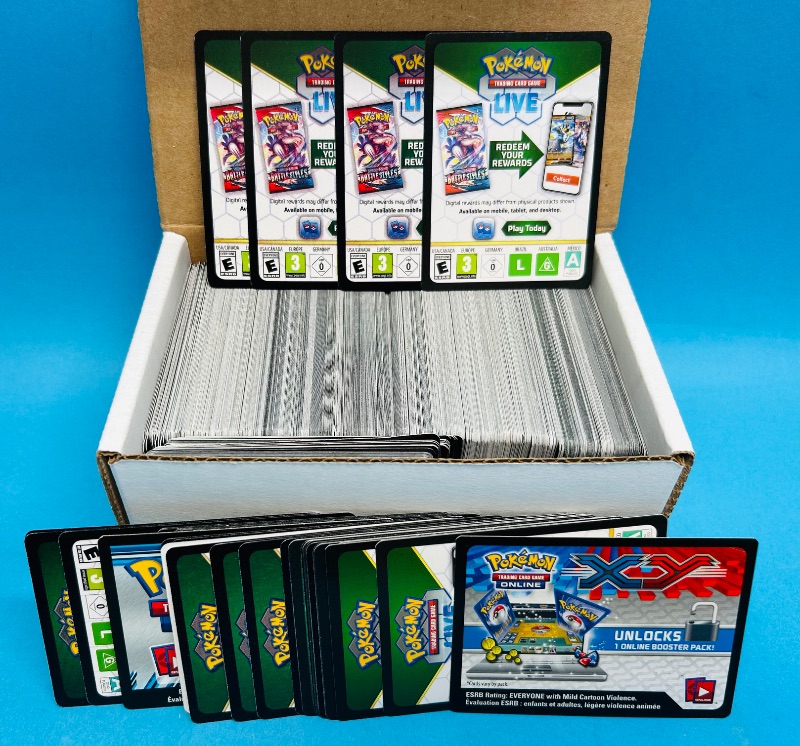 Photo 1 of 593391…hundreds of Pokémon digital play rewards game cards

